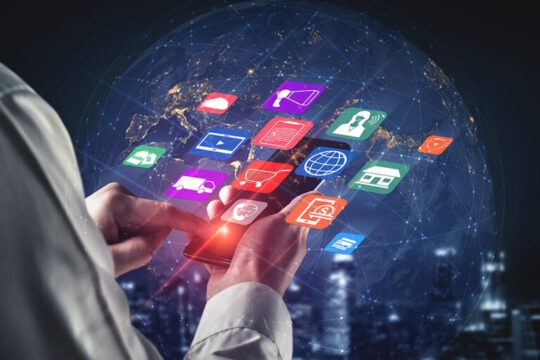 A person using a smartphone with digital icons floating around