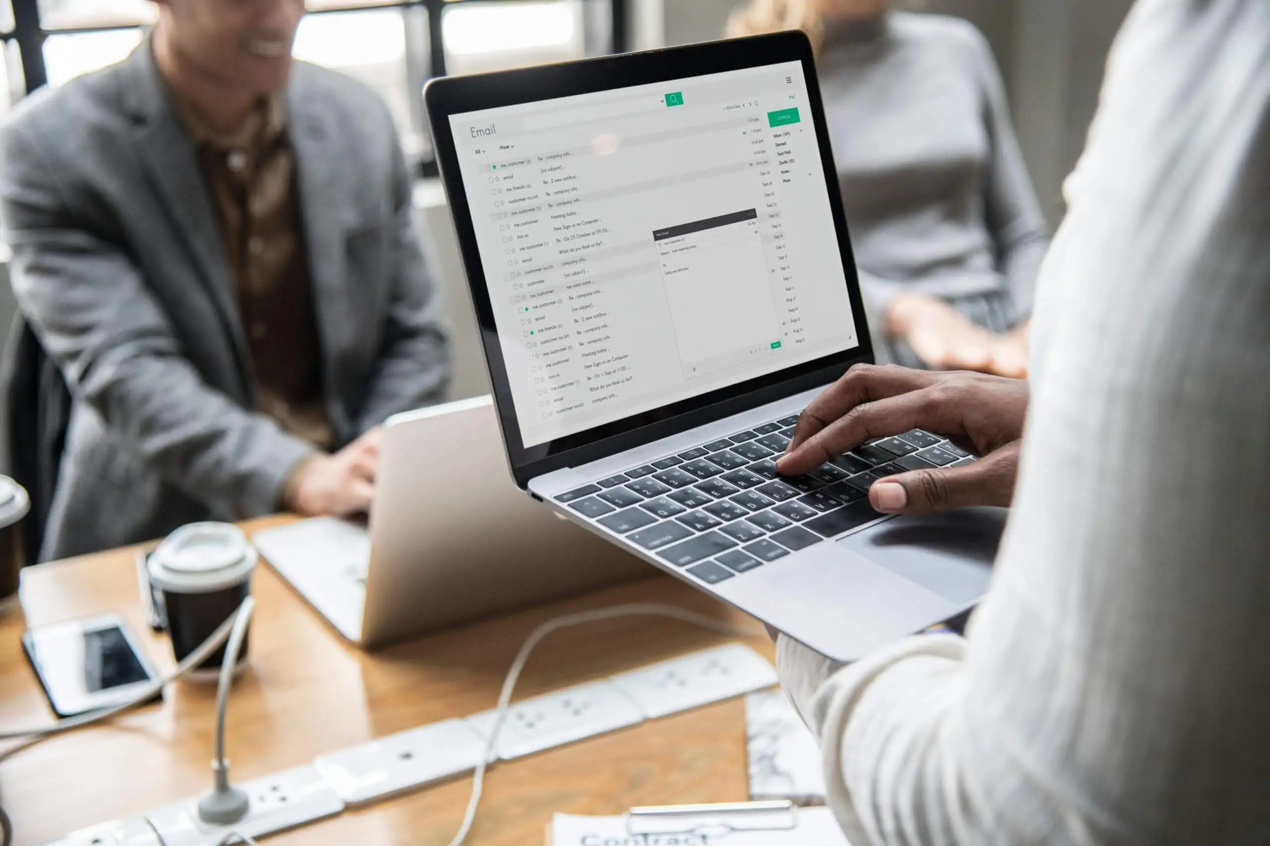 zoomed in view of a person working on email marketing on laptop