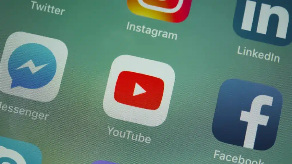 Social media app icons on a smartphone screen.