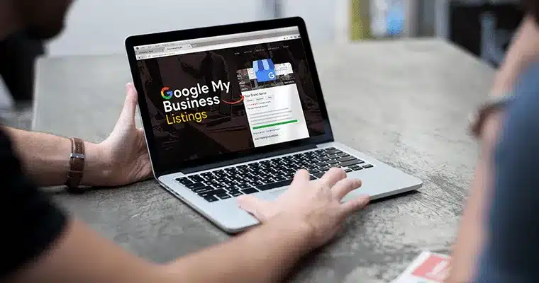 Person viewing Google Business Listings on a laptop and creating gmb for clients