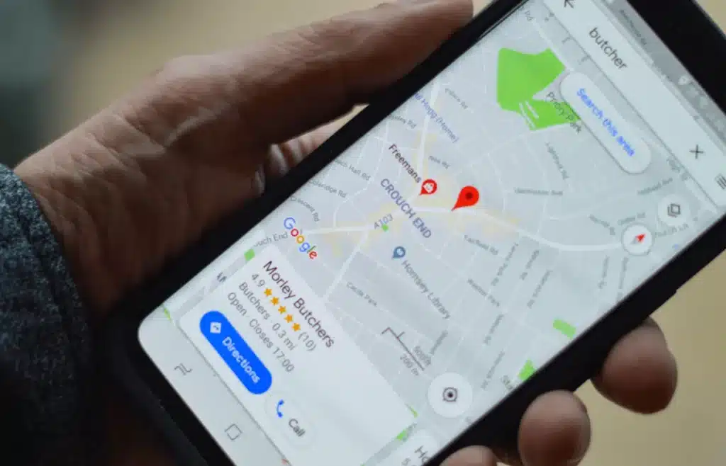 Person viewing a Google Maps business listing on a smartphone.