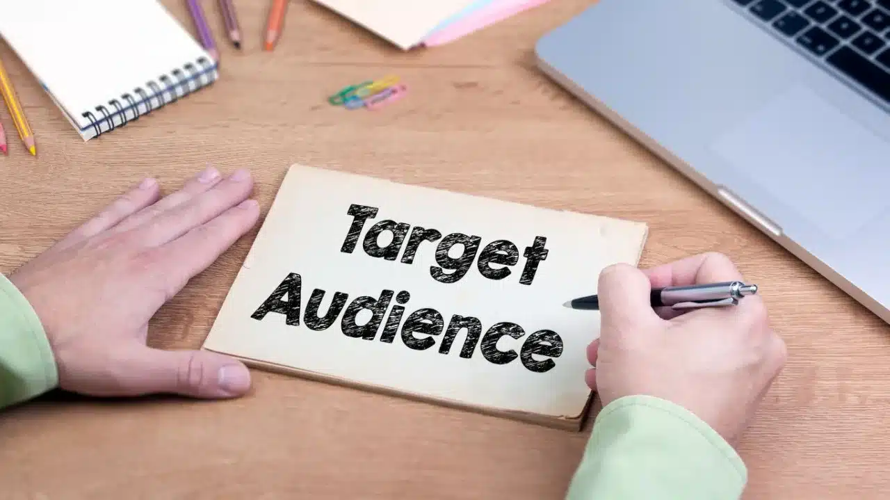 Target audience planning concept with handwritten notes on a desk