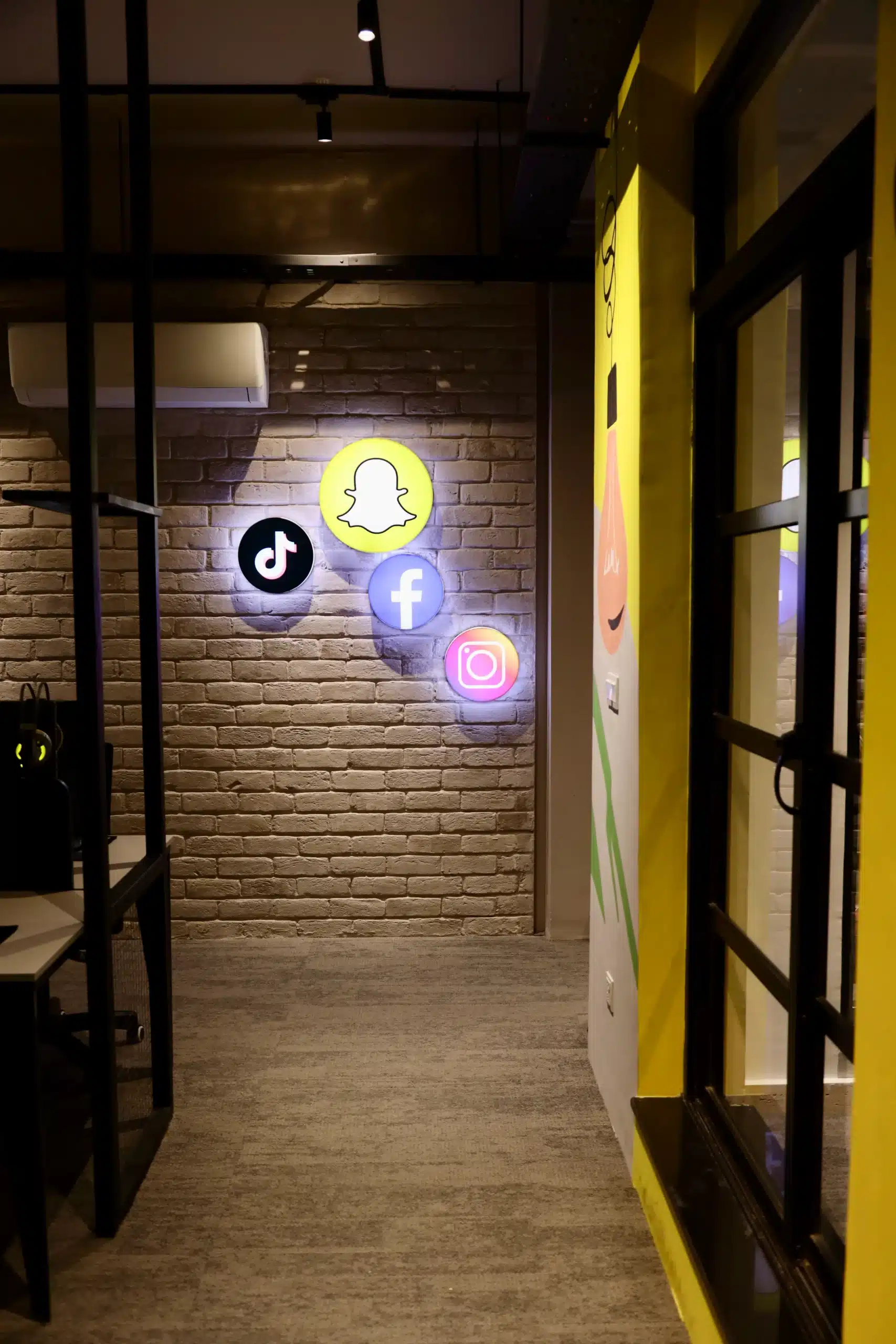 Social media branding elements inside the Hashtag Media office.