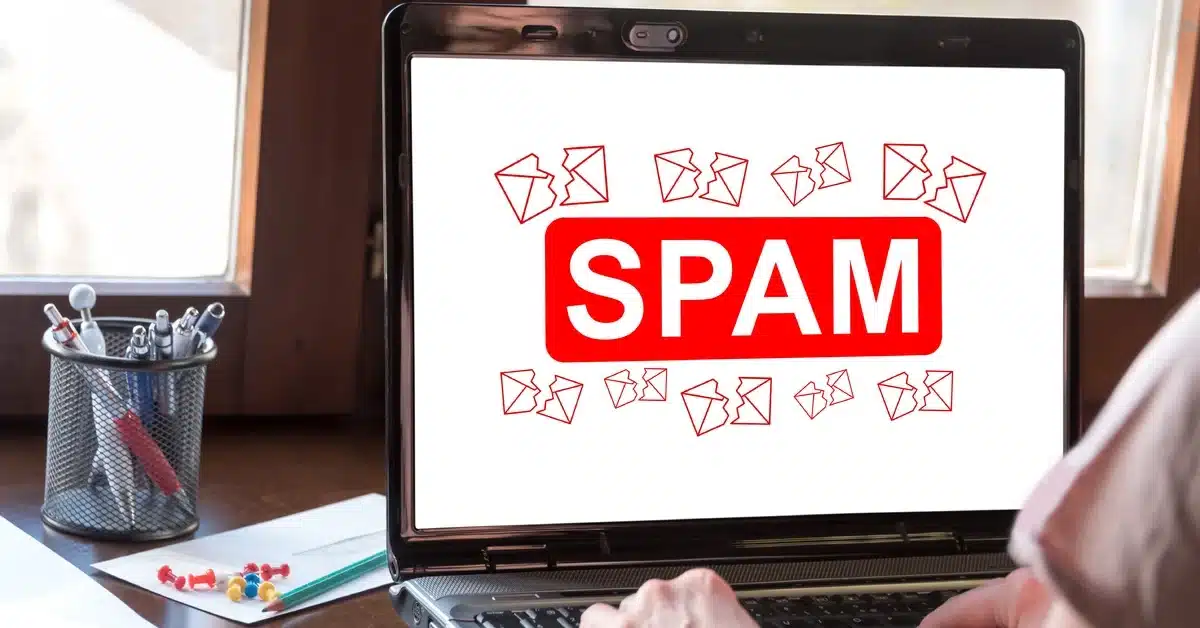 Laptop screen displaying a spam warning message