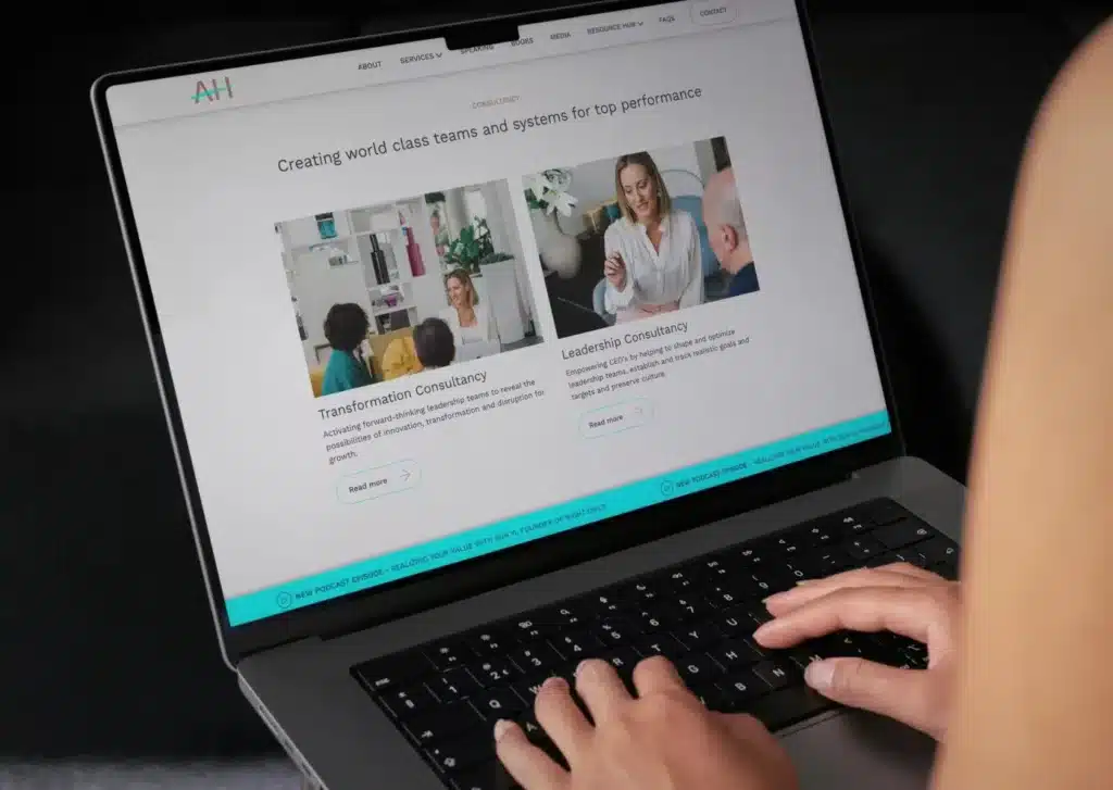 Person browsing a professionally designed website on a laptop.